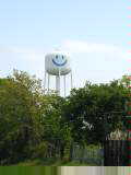 Land gets flatter and water towers go up on posts